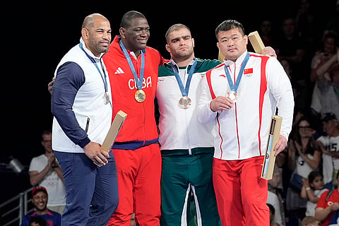 Paris Olympics men's Greco-Roman 130kg wrestling: Chile's Yasmani Acosta Fernandez, silver, Cuba's Mijain Lopez Nunez, gold, Iran's Amin Mirzazadeh, China's Meng Lingzhe, bronze